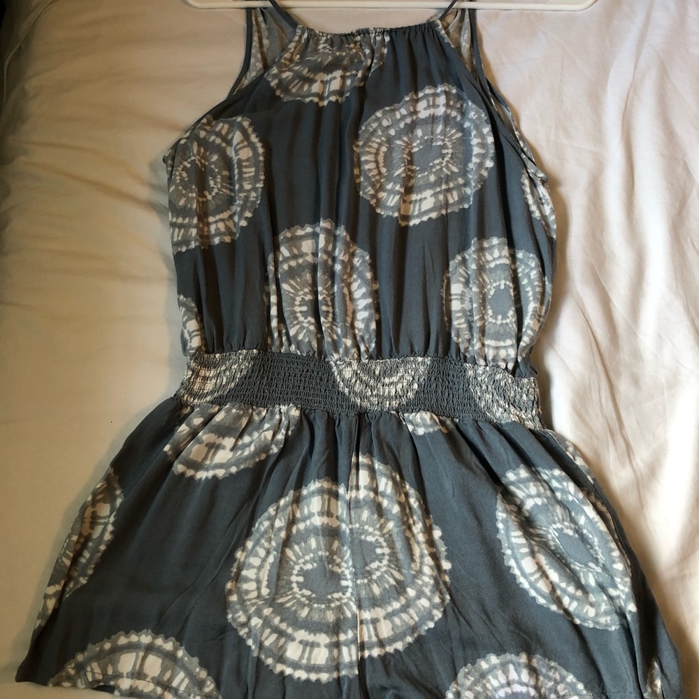 Blue romper with tie-dye patterns